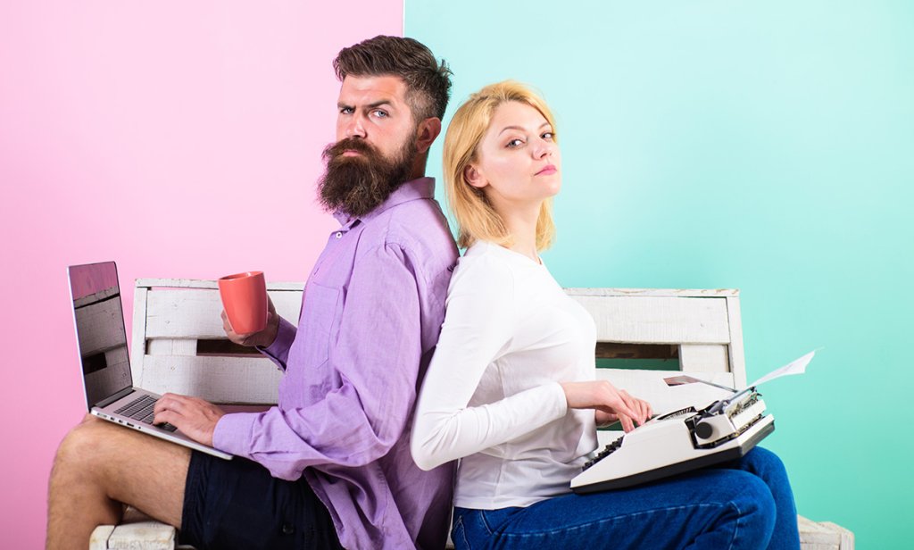 Two people one with laptop and one with typewriter book formatting